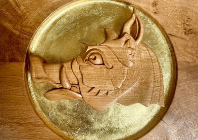 Hand-carved boar's head golf club crest with gold leaf gilding
