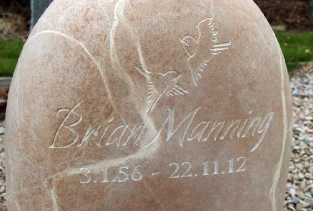 Rounded sandstone headstone